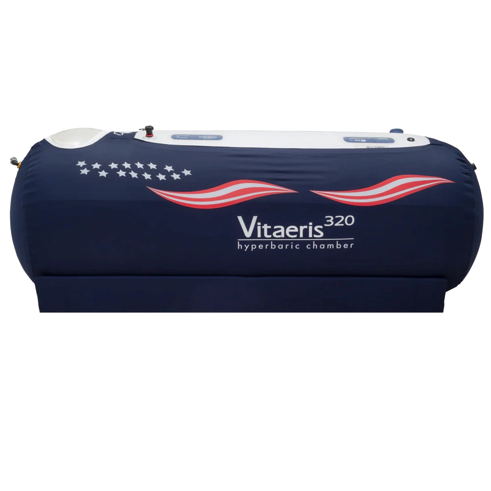A dark blue Vitaeris 320 hyperbaric chamber with white stars and red and white stripes, against a black background.